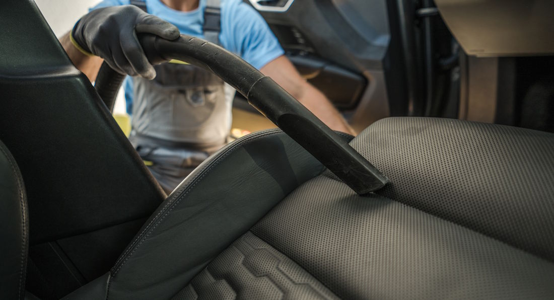vacuuming car interior