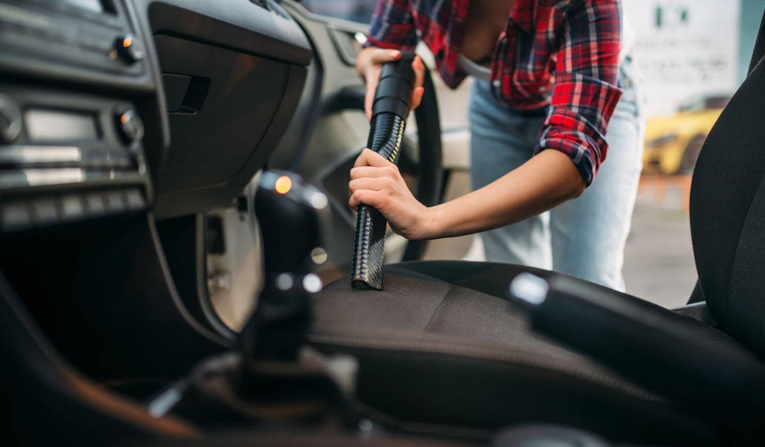 vacuuming a car