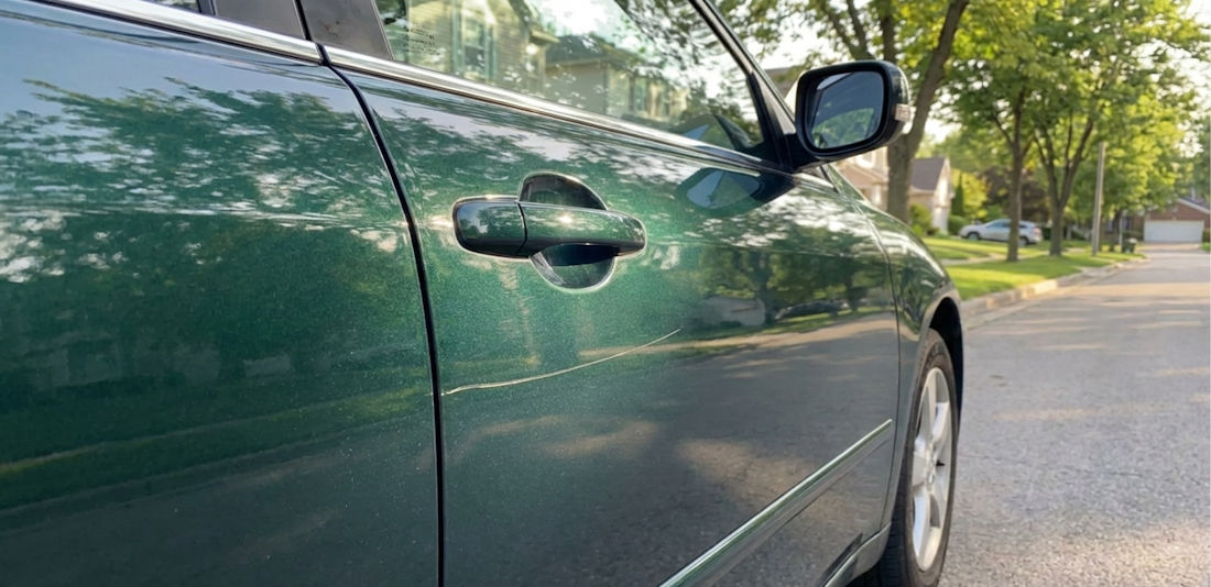 scratch on green car