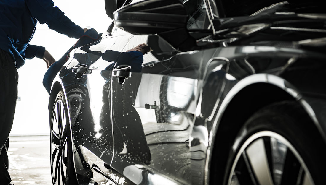 detailing a shiny luxury car