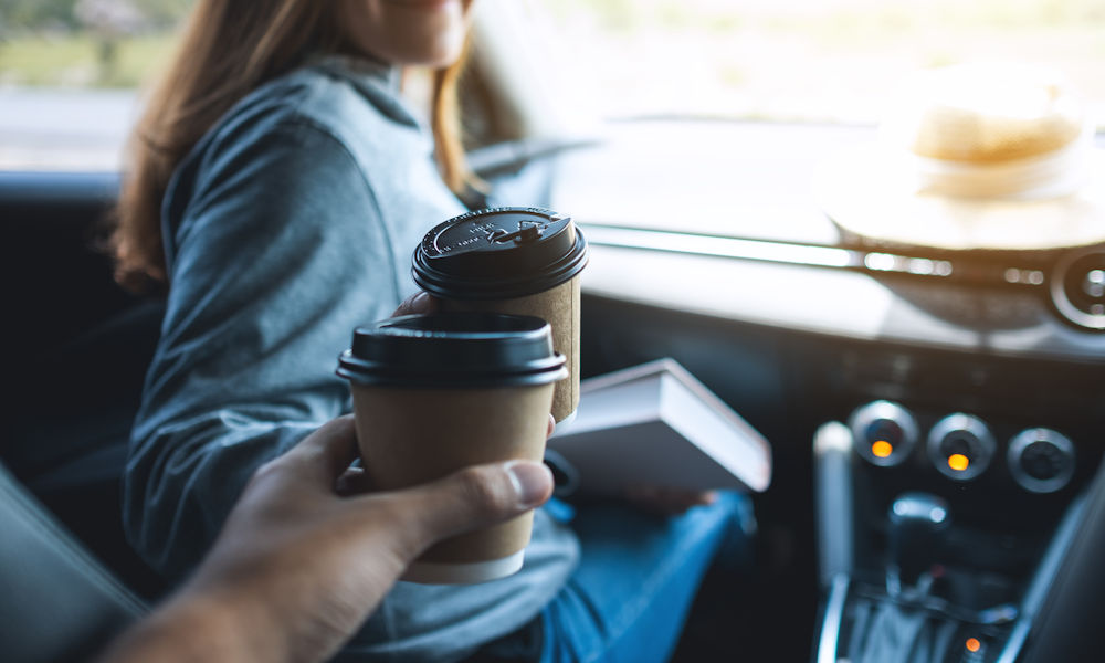 enjoying coffee in the car