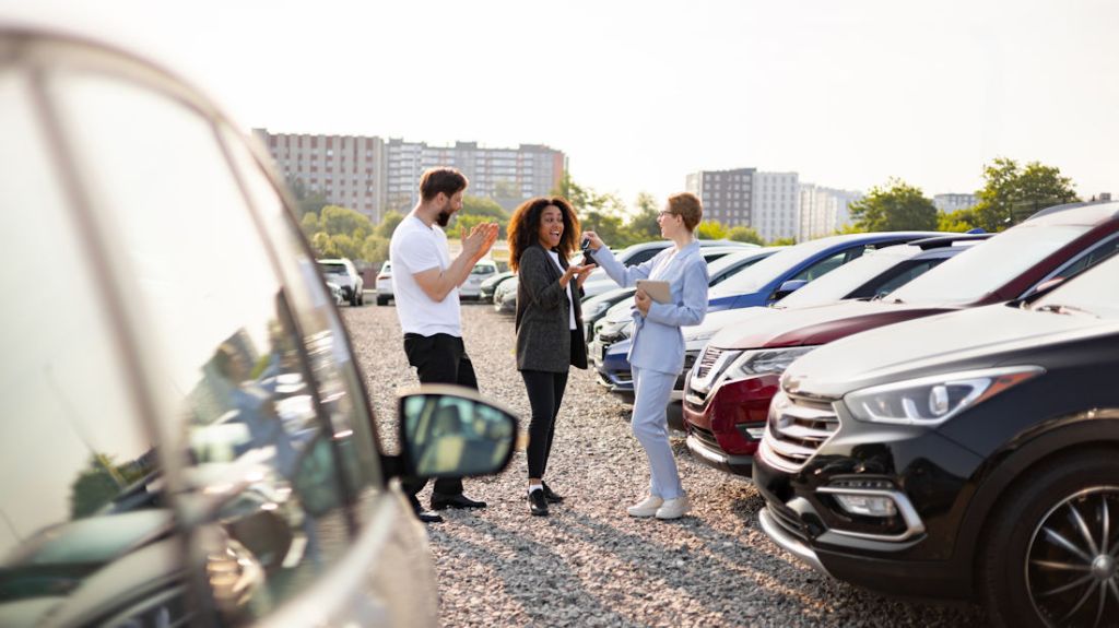 couple at a car dealership