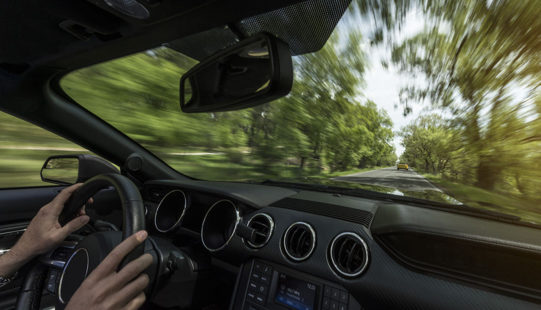 driving fast down the road