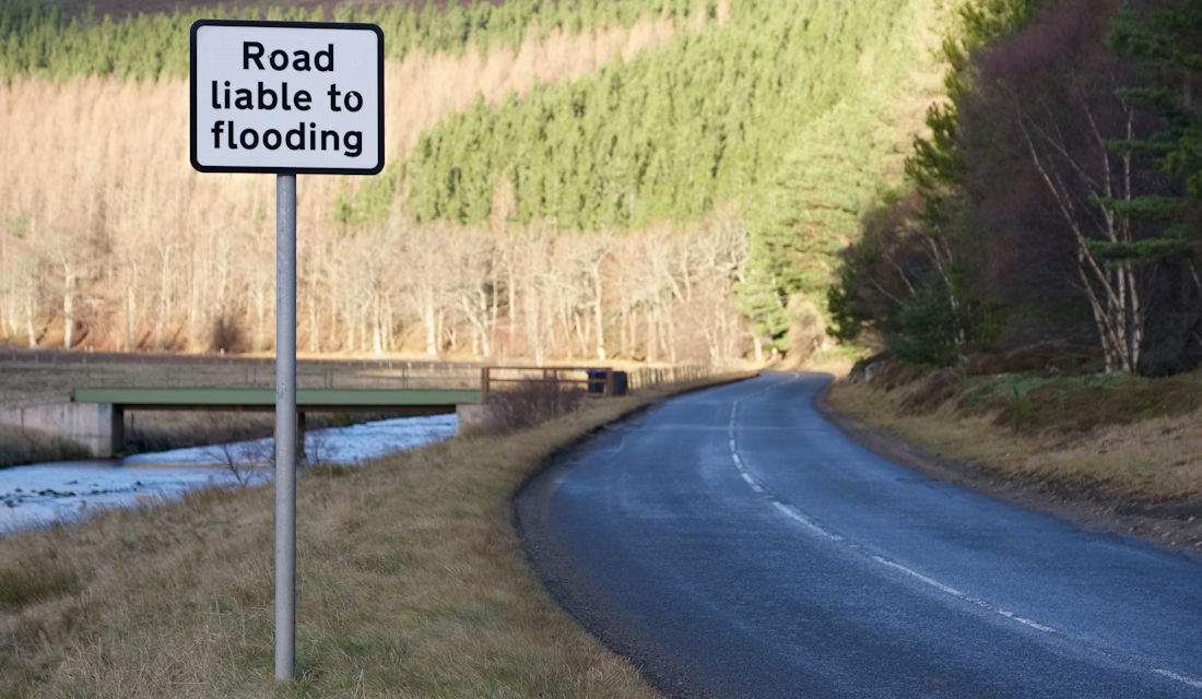 road with flood warnings