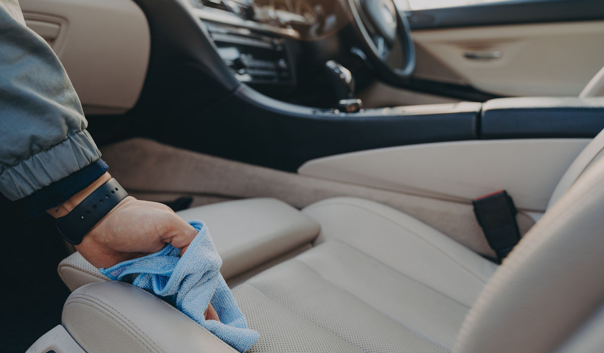 cleaning car seat with a cloth